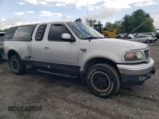 2000 Ford F-150 XL with VIN 2FTRX08L2YCA22507, listed as a Copart auction lot 55390075 with 197,785 mi miles and Salvage title. Bid and sale history available at DreamBid. Image 4.
