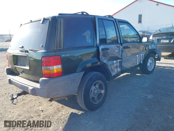 1997 Jeep Grand Cherokee Laredo with VIN 1J4GZ58SXVC687950, listed as a IAAI auction lot 40978411 with 176,514 mi miles. Bid and sale history available at carsss.com. Image 4.