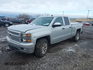 2014 Chevrolet Silverado 1500 LT with VIN 1GCVKREC5EZ115459, listed as a IAAI auction lot 41143910 with 275,008 mi miles and . Bid and sale history available at DreamBid. Image 2.