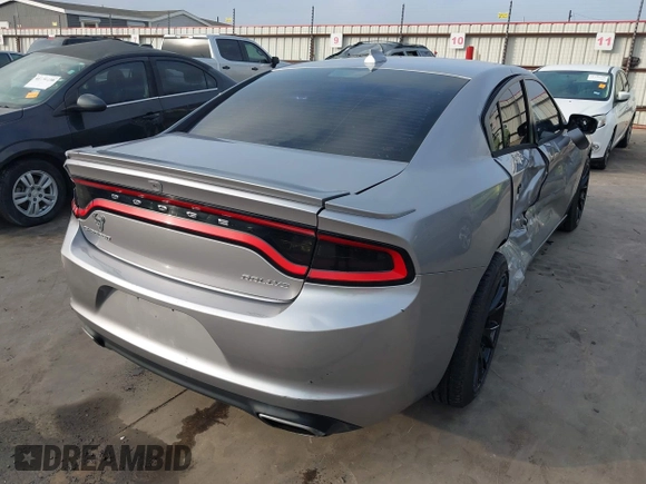 2015 Dodge Charger SXT with VIN 2C3CDXHG4FH884058, listed as a IAAI auction lot 41724894 with 202,701 mi miles and . Bid and sale history available at DreamBid. Image 4.