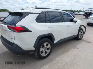 2019 Toyota RAV4 XLE with VIN 2T3W1RFVXKW033696, listed as a IAAI auction lot 42044151 with 126,872 mi miles and . Bid and sale history available at DreamBid. Image 4.