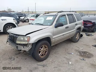 2004 Jeep Grand Cherokee Laredo with VIN 1J4GX48S44C301120, listed as a IAAI auction lot 41281556 with 267,246 mi miles. Bid and sale history available at carsss.com. Image 2.
