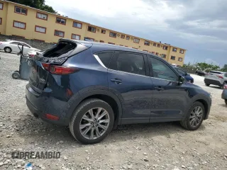 2021 Mazda CX-5 Grand Touring z VIN JM3KFBDM5M0464611, wystawiony jako Copart lot #62829065 z przebiegiem 20 525 mil mil oraz Nie do naprawy • Non repairable. Historia ofert i sprzedaży dostępna na DreamBid. Obrazek 3.
