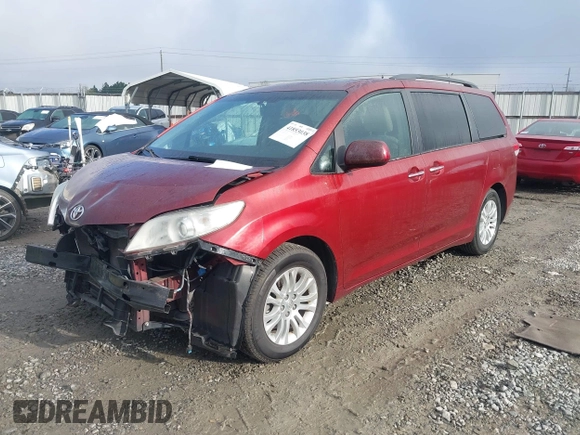 2014 Toyota Sienna XLE with VIN 5TDYK3DCXES471676, listed as a IAAI auction lot 41853038 with 169,790 mi miles. Bid and sale history available at carsss.com. Image 2.