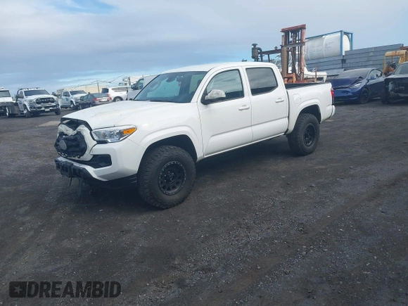 2023 Toyota Tacoma SR with VIN 3TYCZ5AN4PT168312, listed as a IAAI auction lot 42555775 with 8,288 mi miles and . Bid and sale history available at DreamBid. Image 2.