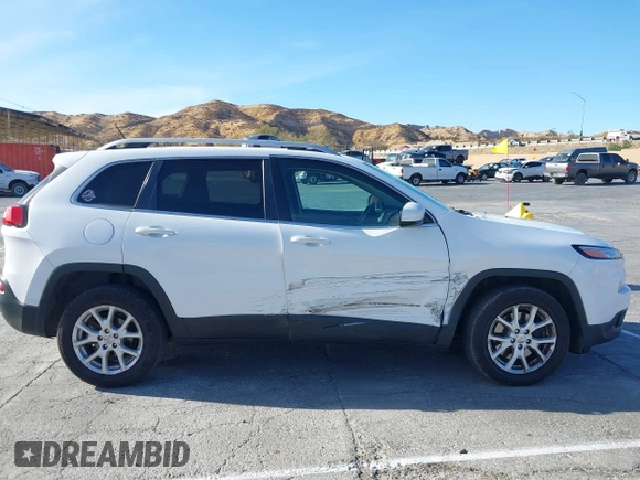 2016 Jeep Cherokee Latitude with VIN 1C4PJLCB9GW149217, listed as a IAAI auction lot 41365164 with 144,702 mi miles. Bid and sale history available at carsss.com. Image 13.