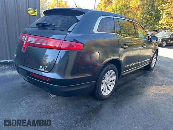 2015 Lincoln MKT with VIN 2LMHJ5NK0FBL03293, listed as a Copart auction lot 77810284 with 115,725 mi miles and Clean Title. Bid and sale history available at DreamBid. Image 4.