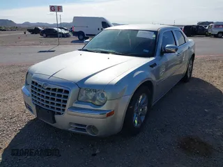 2006 Chrysler 300 C with VIN 2C3KA63H46H154990, listed as a IAAI auction lot 42004790 with 233,673 mi miles. Bid and sale history available at carsss.com. Image 2.