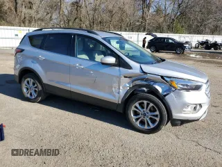 2018 Ford Escape SE with VIN 1FMCU0G90JUC13607, listed as a Copart auction lot 46534215 with 131,633 mi miles and Salvage Title. Bid and sale history available at carsss.com. Image 4.