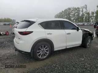2019 Mazda CX-5 Grand Touring with VIN JM3KFBDM4K0669589, listed as a Copart auction lot 54948455 with 64,475 mi miles and Salvage Title. Bid and sale history available at carsss.com. Image 3.