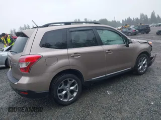 2015 Subaru Forester Touring with VIN JF2SJAUC1FH457069, listed as a IAAI auction lot 42293542 with 71,689 mi miles and . Bid and sale history available at DreamBid. Image 4.