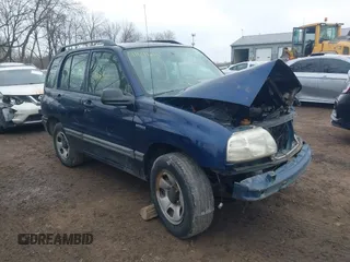 2002 Suzuki Vitara JLS z VIN 2S3TE52V526110669, wystawiony jako IAAI lot #41646111 z przebiegiem 240 129 mil mil oraz . Historia ofert i sprzedaży dostępna na DreamBid. Obrazek 1.
