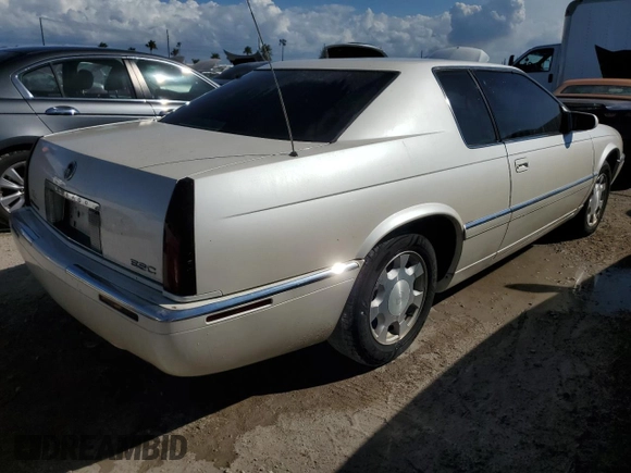 2000 Cadillac Eldorado z VIN 1G6EL12Y0YB704658, wystawiony jako Copart lot #77596814 z przebiegiem Nie podano mil oraz Nie do naprawy • Non repairable. Historia ofert i sprzedaży dostępna na DreamBid. Obrazek 3.