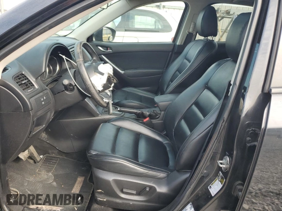 2014 Mazda CX-5 Touring with VIN JM3KE2CY9E0375990, listed as a Copart auction lot 50875165 with 166,574 mi miles and Salvage Title. Bid and sale history available at carsss.com. Image 7.