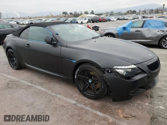 2009 BMW 6 Series M6 z VIN WBSEK935X9CY80091, wystawiony jako Copart lot #43348935 z przebiegiem 128 438 mil mil oraz Tytuł czysty. Historia ofert i sprzedaży dostępna na DreamBid. Obrazek 4.
