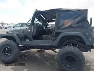 2004 Jeep Wrangler Rubicon z VIN 1J4FA69S84P727716, wystawiony jako IAAI lot #42162129 z przebiegiem 90 844 mil mil oraz . Historia ofert i sprzedaży dostępna na DreamBid. Obrazek 15.