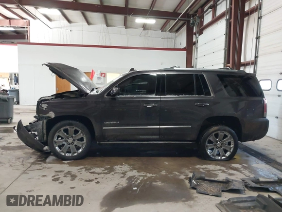 2016 GMC Yukon Denali with VIN 1GKS2CKJ8GR215954, listed as a IAAI auction lot 41362739 with 143,982 mi miles. Bid and sale history available at carsss.com. Image 13.