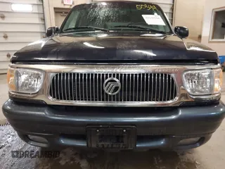 1999 Mercury Mountaineer z VIN 4M2DU55P0XUJ08169, wystawiony jako IAAI lot #42150344 z przebiegiem 164 994 mil mil oraz . Historia ofert i sprzedaży dostępna na DreamBid. Obrazek 6.