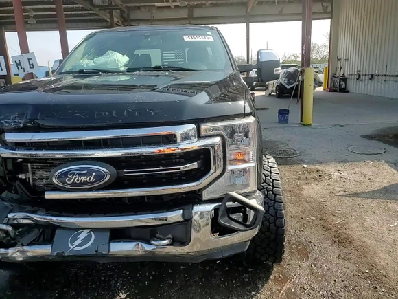 2021 Ford Super Duty F-250 SRW XL with VIN 1FT7W2BT1MEC51277, listed as a Copart auction lot 43544475 with 99,324 mi miles and Salvage Title. Bid and sale history available at carsss.com. Image 14.
