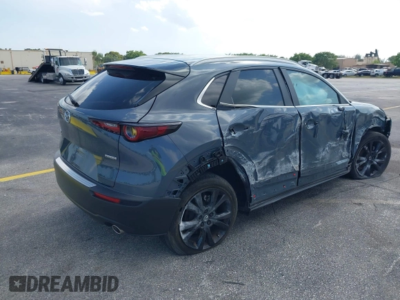 2023 Mazda CX-30 S Carbon Edition with VIN 3MVDMBCM4PM579080, listed as a IAAI auction lot 41941082 with 5,444 mi miles and . Bid and sale history available at DreamBid. Image 4.