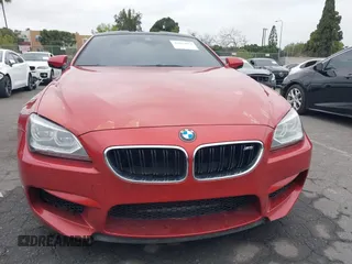 2013 BMW M6 z VIN WBSLX9C55DC968497, wystawiony jako IAAI lot #41863884 z przebiegiem 128 241 mil mil oraz . Historia ofert i sprzedaży dostępna na DreamBid. Obrazek 13.