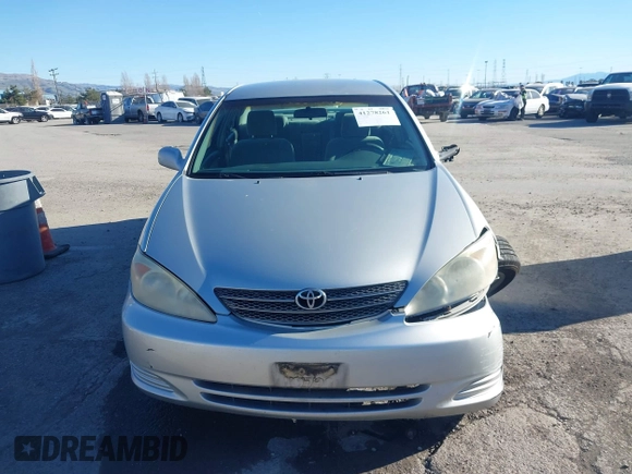 2002 Toyota Camry XLE z VIN 4T1BF30K82U506516, wystawiony jako IAAI lot #41278261 z przebiegiem 211 049 mil mil oraz . Historia ofert i sprzedaży dostępna na DreamBid. Obrazek 12.