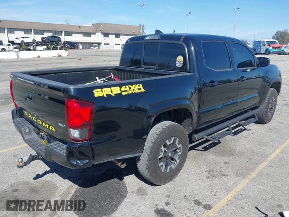 2018 Toyota Tacoma SR with VIN 3TMCZ5AN2JM127244, listed as a IAAI auction lot 41698199 with 61,535 mi miles and . Bid and sale history available at DreamBid. Image 4.