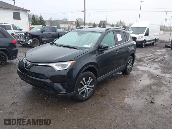2018 Toyota RAV4 LE with VIN 2T3BFREV2JW788700, listed as a IAAI auction lot 41986212 with 87,704 mi miles. Bid and sale history available at carsss.com. Image 17.