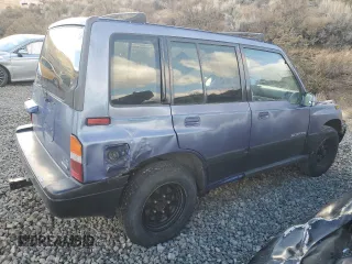 1995 Suzuki Sidekick JX z VIN 2S3TD03V5S6403069, wystawiony jako Copart lot #80273204 z przebiegiem Nie podano mil oraz Szkody całkowita. Historia ofert i sprzedaży dostępna na DreamBid. Obrazek 3.