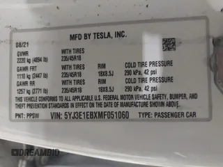 2021 Tesla Model 3 Long Range with VIN 5YJ3E1EBXMF051060, listed as a IAAI auction lot 41958018 with 65,631 mi miles. Bid and sale history available at carsss.com. Image 9.