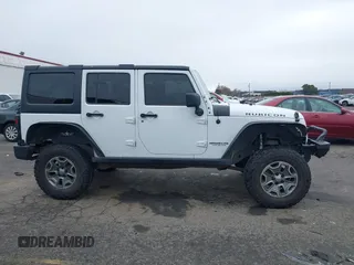 2014 Jeep Wrangler Unlimited Rubicon with VIN 1C4BJWFGXEL283929, listed as a IAAI auction lot 41812052 with 137,790 mi miles and . Bid and sale history available at DreamBid. Image 13.