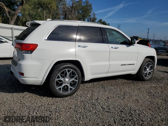 2019 Jeep Grand Cherokee Overland with VIN 1C4RJFCT2KC834690, listed as a Copart auction lot 84303144 with 63,053 mi miles and Salvage Title. Bid and sale history available at carsss.com. Image 3.