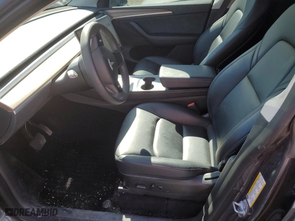 2022 Tesla Model Y Long Range with VIN 7SAYGAEEXNF517729, listed as a Copart auction lot 51592585 with 60,781 mi miles and Salvage Title. Bid and sale history available at carsss.com. Image 7.