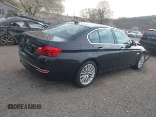 2014 BMW 5 Series 528i xDrive with VIN WBA5A7C52ED616976, listed as a IAAI auction lot 42067334 with 98,286 mi miles and . Bid and sale history available at DreamBid. Image 4.