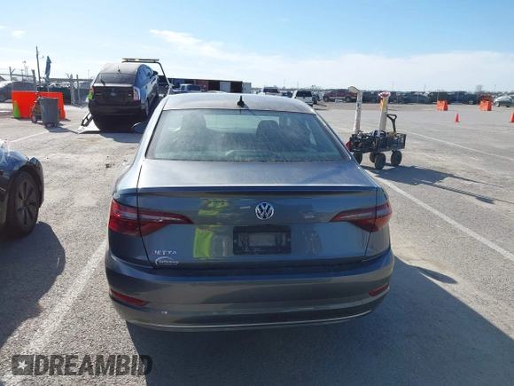 2021 Volkswagen Jetta S z VIN 3VWC57BU8MM098931, wystawiony jako IAAI lot #41818622 z przebiegiem 10 469 mil mil oraz . Historia ofert i sprzedaży dostępna na DreamBid. Obrazek 17.