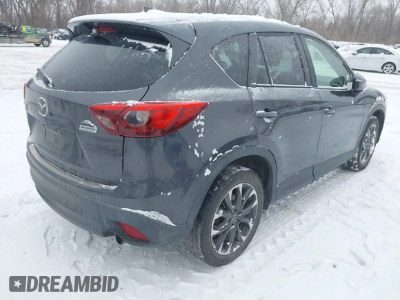 2016 Mazda CX-5 Grand Touring with VIN JM3KE4DY2G0913412, listed as a IAAI auction lot 41616132 with 85,166 mi miles. Bid and sale history available at carsss.com. Image 4.