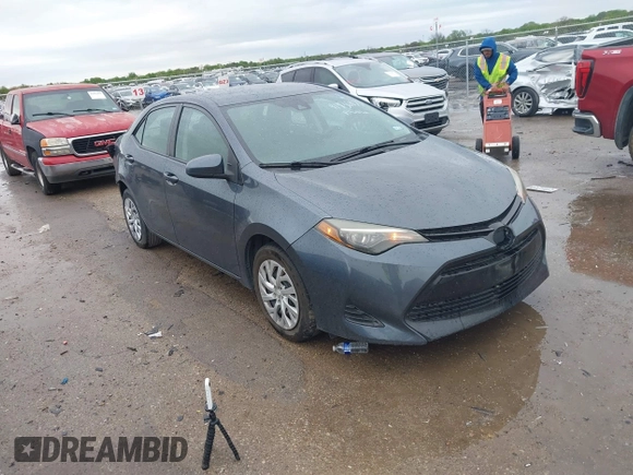2019 Toyota Corolla L with VIN 5YFBURHE8KP873067, listed as a IAAI auction lot 41936471 with 75,076 mi miles and . Bid and sale history available at carsss.com. Image 1.