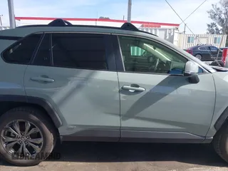 2023 Toyota RAV4 Hybrid XLE Premium with VIN JTMB6RFV8PD086983, listed as a IAAI auction lot 41612674 with 70,817 mi miles. Bid and sale history available at carsss.com. Image 14.