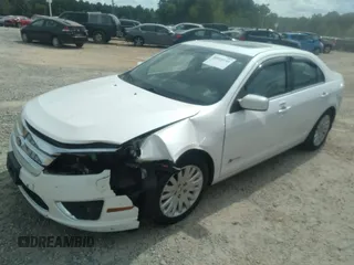 2010 Ford Fusion Hybrid z VIN 3FADP0L31AR387443, wystawiony jako IAAI lot #40034145 z przebiegiem 153 847 mil mil oraz . Historia ofert i sprzedaży dostępna na DreamBid. Obrazek 2.