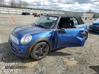 2014 MINI Convertible with VIN WMWZN3C55ET861078, listed as a Copart auction lot 50240665 with 50,541 mi miles and Salvage Title. Bid and sale history available at DreamBid. Image 1.