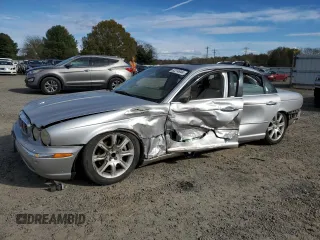 2004 Jaguar XJ VDP with VIN SAJWA74C94SG23829, listed as a Copart auction lot 82214944 with 126,887 mi miles and Salvage Title. Bid and sale history available at carsss.com. Image 1.