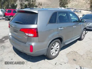 2014 Kia Sorento EX with VIN 5XYKU4A74EG498074, listed as a IAAI auction lot 42136870 with 128,142 mi miles. Bid and sale history available at carsss.com. Image 4.
