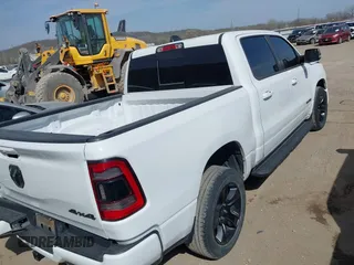 2021 Ram 1500 Big Horn with VIN 1C6SRFFT0MN521027, listed as a IAAI auction lot 41830596 with 55,013 mi miles and . Bid and sale history available at DreamBid. Image 4.