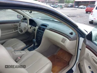 1999 Toyota Solara SE with VIN 2T1CF22PXXC233661, listed as a IAAI auction lot 42196878 with 157,682 mi miles. Bid and sale history available at carsss.com. Image 5.