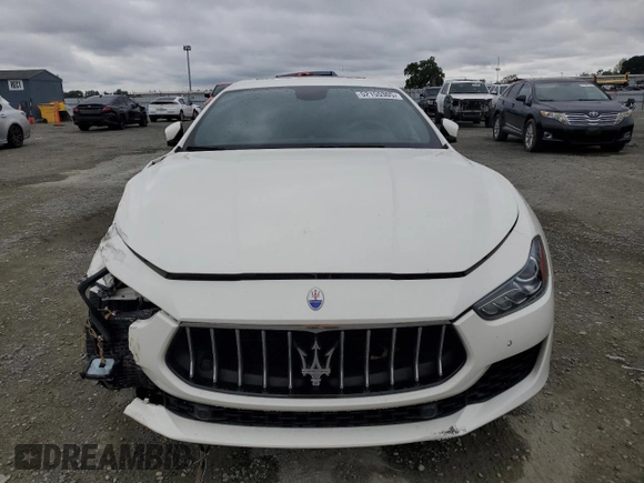2018 Maserati Ghibli z VIN ZAM57XSA9J1271727, wystawiony jako Copart lot #52155305 z przebiegiem 62 081 mil mil oraz Szkoda całkowita • Salvage title. Historia ofert i sprzedaży dostępna na DreamBid. Obrazek 5.