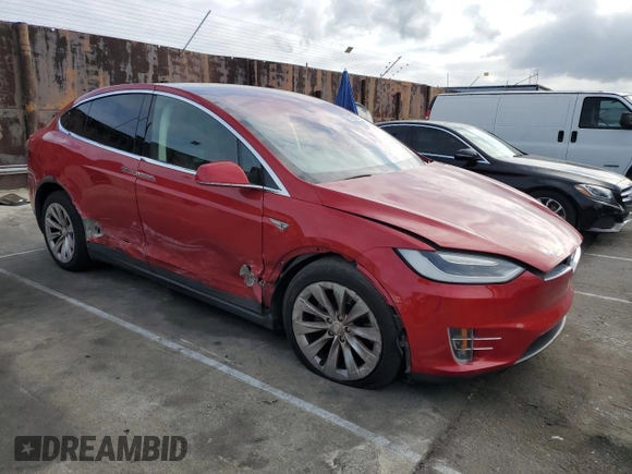 2016 Tesla Model X 70D with VIN 5YJXCAE28GF002399, listed as a Copart auction lot 50884225 with 73,113 mi miles and Salvage Title. Bid and sale history available at DreamBid. Image 4.