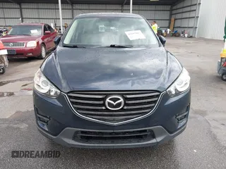 2016 Mazda CX-5 Sport with VIN JM3KE2BY0G0850298, listed as a IAAI auction lot 42107007 with 97,478 mi miles. Bid and sale history available at carsss.com. Image 12.