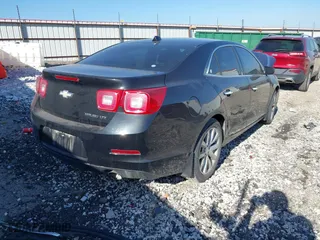 2013 Chevrolet Malibu LTZ with VIN 1G11H5SA6DF217077, listed as a IAAI auction lot 41779449 with 150,412 mi miles. Bid and sale history available at carsss.com. Image 4.