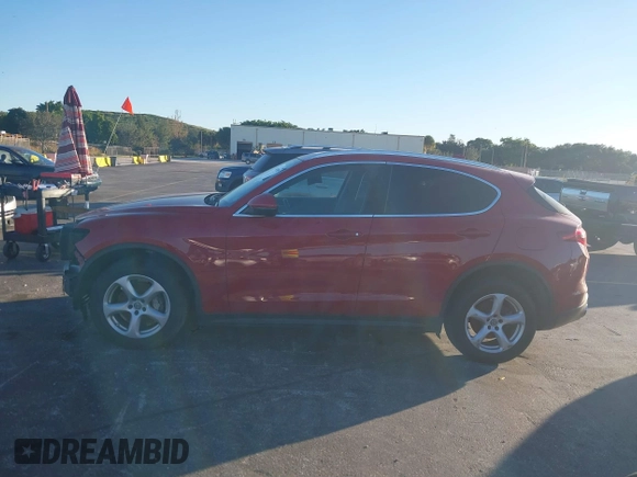 2018 Alfa Romeo Stelvio z VIN ZASFAKAN3J7C20066, wystawiony jako IAAI lot #40879859 z przebiegiem 50 131 mil mil oraz . Historia ofert i sprzedaży dostępna na DreamBid. Obrazek 15.