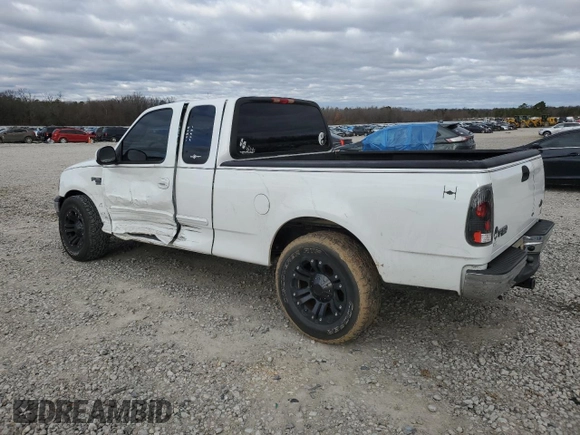 2002 Ford F-150 XL with VIN 1FTRX17W12NA96391, listed as a Copart auction lot 87000064 with 199,867 mi miles and Salvage Title. Bid and sale history available at carsss.com. Image 2.